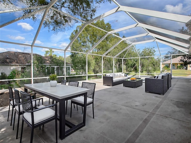 view of patio featuring an outdoor living space and glass enclosure