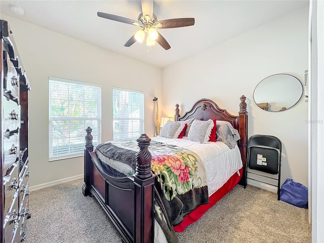 bedroom featuring light carpet, ceiling fan, and baseboards