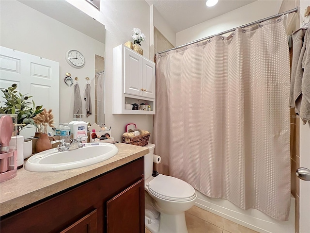 bathroom featuring shower / bath combo, vanity, toilet, and tile patterned floors