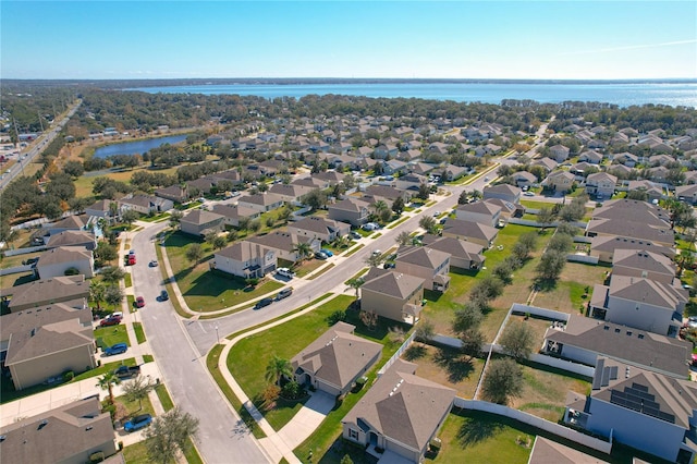 birds eye view of property featuring a residential view and a water view