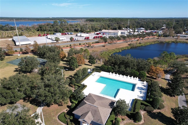 birds eye view of property with a water view