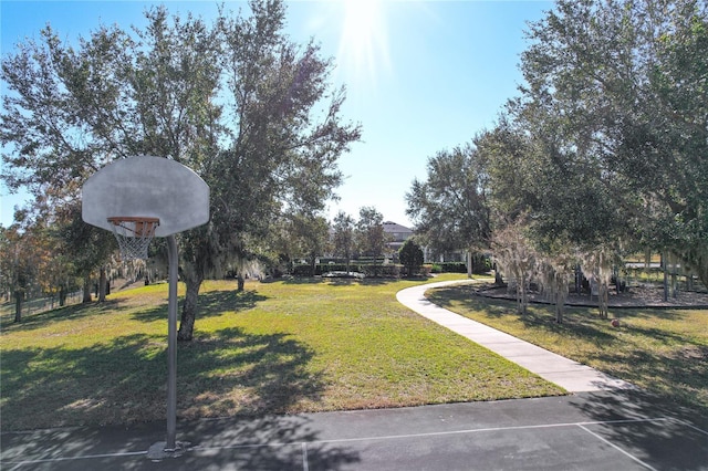 view of yard with community basketball court