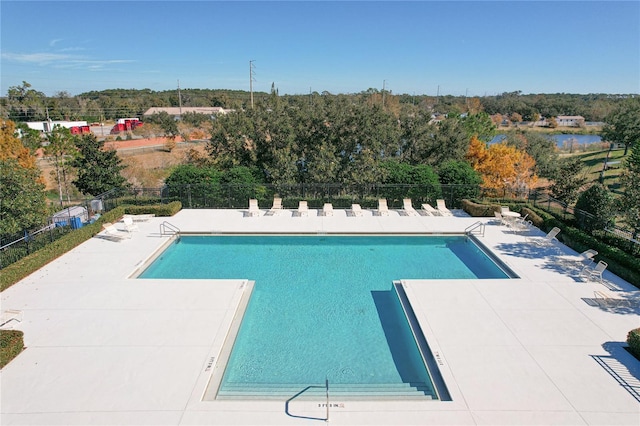 pool featuring a patio and fence