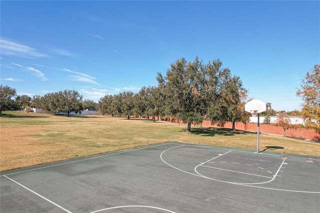 view of basketball court featuring community basketball court and a lawn