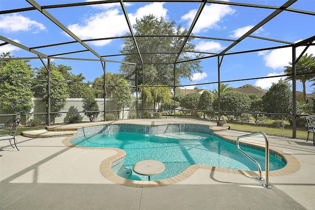 view of swimming pool featuring a patio and glass enclosure