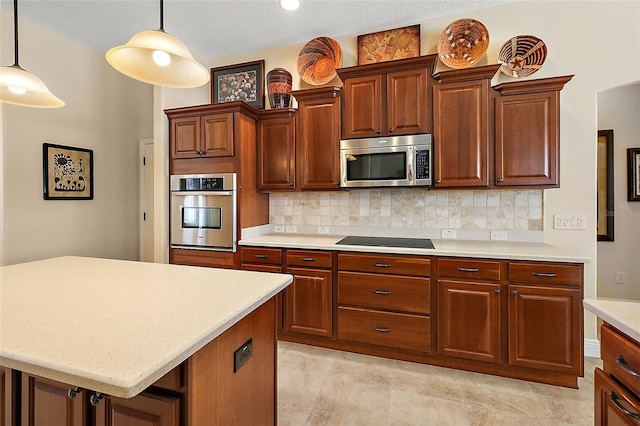 kitchen featuring stainless steel appliances, backsplash, pendant lighting, a textured ceiling, and a kitchen island