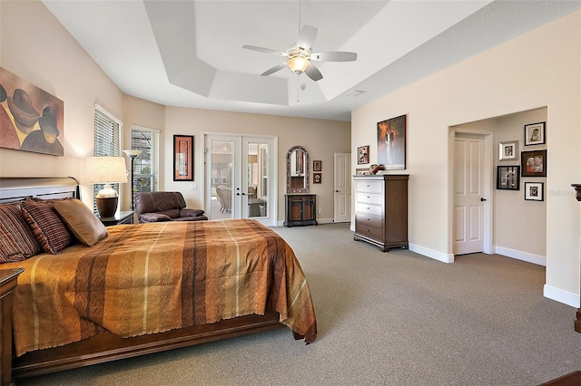 carpeted bedroom with a raised ceiling, ceiling fan, access to exterior, and french doors