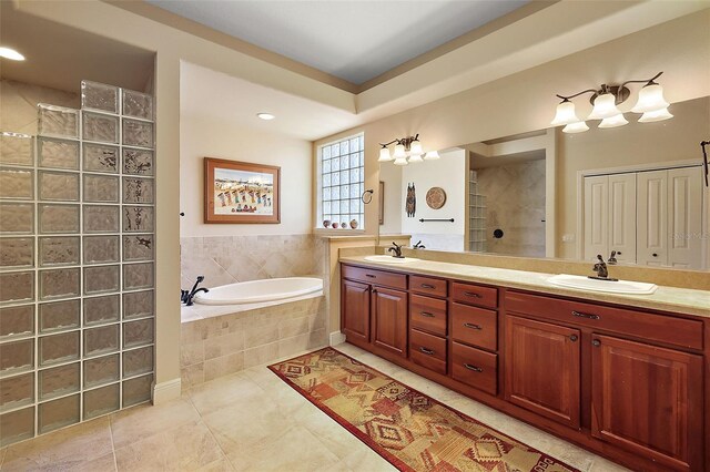 bathroom with vanity, tile patterned floors, and independent shower and bath