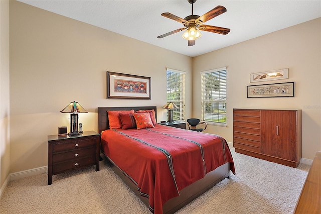 bedroom with light carpet and ceiling fan