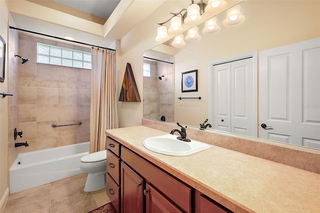 full bathroom with tile patterned flooring, shower / tub combo with curtain, vanity, and toilet