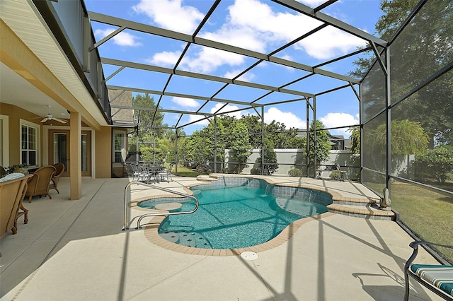 view of pool featuring a lanai, ceiling fan, and a patio