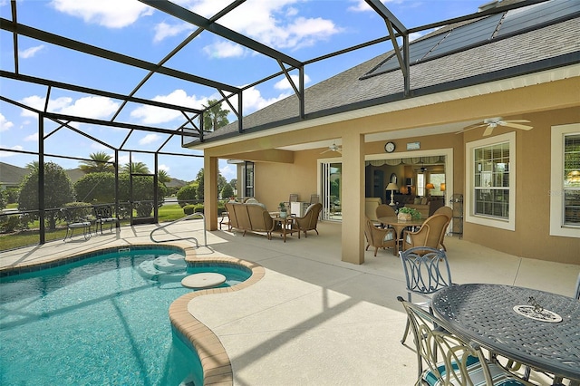 view of pool featuring a lanai, an outdoor living space, ceiling fan, and a patio area