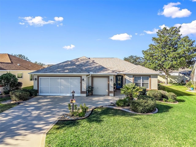 ranch-style house featuring a front yard and a garage