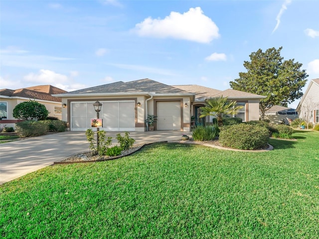 view of front of house with a garage and a front yard