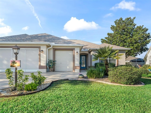 single story home featuring a front yard and a garage