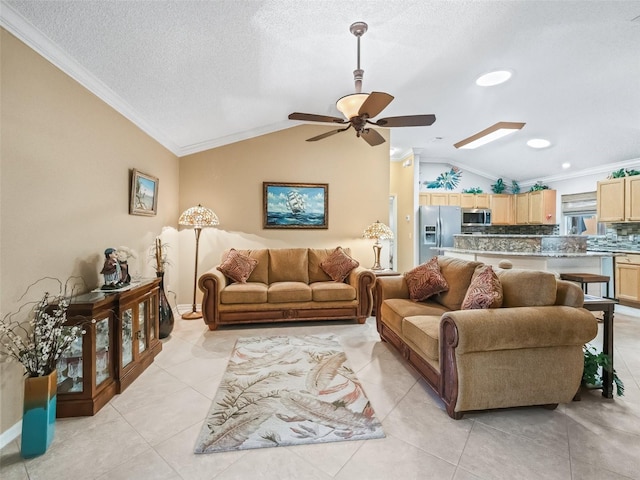 tiled living room featuring a textured ceiling, ceiling fan, lofted ceiling, and crown molding