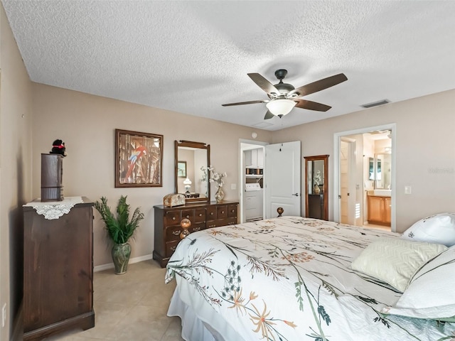 bedroom featuring a textured ceiling, connected bathroom, ceiling fan, and light tile patterned flooring