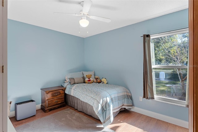 bedroom featuring light hardwood / wood-style flooring and ceiling fan