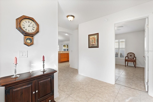 hallway featuring light tile patterned floors