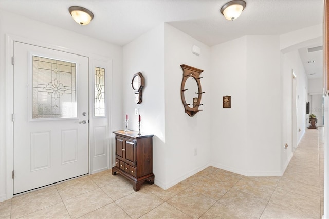 foyer entrance featuring light tile patterned floors