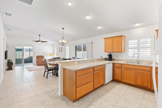 kitchen with dishwasher, sink, ceiling fan with notable chandelier, and plenty of natural light