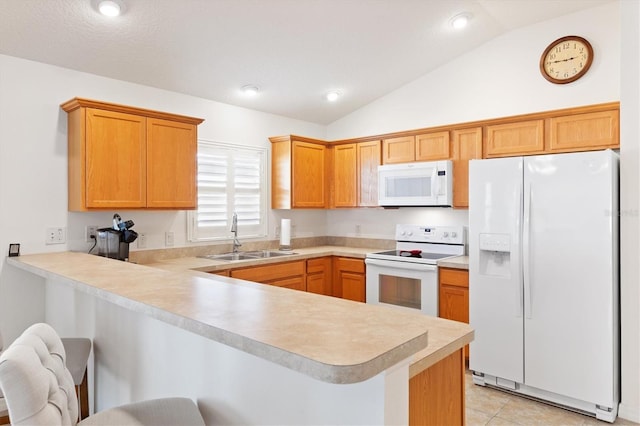 kitchen with sink, kitchen peninsula, lofted ceiling, white appliances, and a breakfast bar area