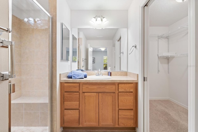 bathroom featuring vanity and walk in shower