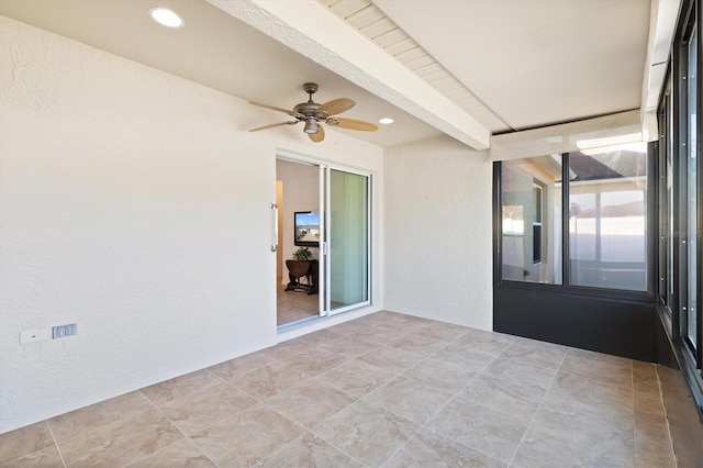 unfurnished sunroom with ceiling fan and beamed ceiling