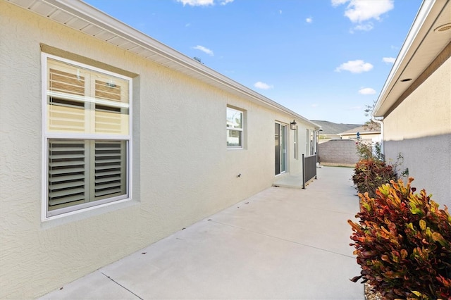 view of home's exterior with a patio area