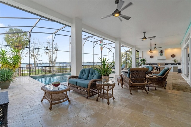 exterior space featuring an outdoor living space, a water view, and glass enclosure