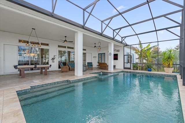 view of swimming pool featuring a lanai, a patio area, ceiling fan, and an outdoor hangout area