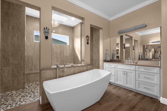 bathroom with separate shower and tub, crown molding, vanity, and wood-type flooring