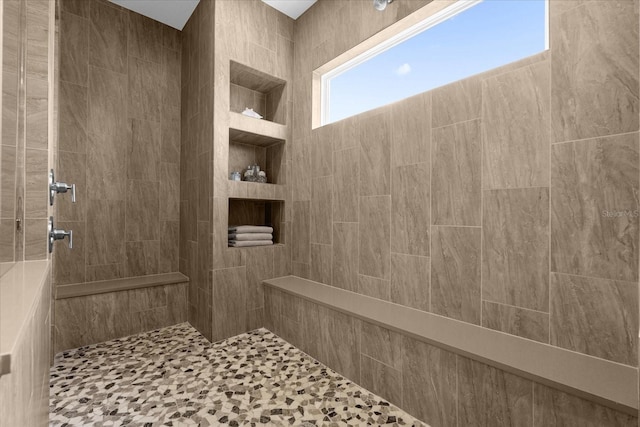 bathroom with tiled shower