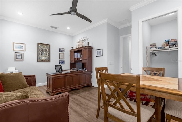 office with light hardwood / wood-style flooring, ceiling fan, and crown molding