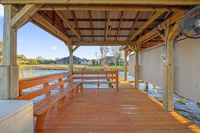 dock area featuring a deck with water view