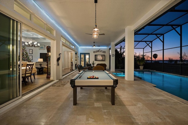 recreation room featuring ceiling fan with notable chandelier and pool table