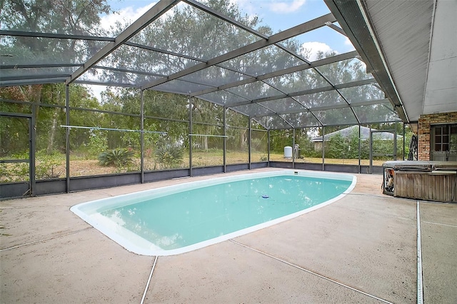 view of swimming pool featuring a lanai, a patio, and a hot tub