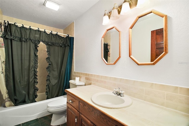 full bathroom with shower / bath combination with curtain, tile patterned floors, a textured ceiling, tile walls, and toilet