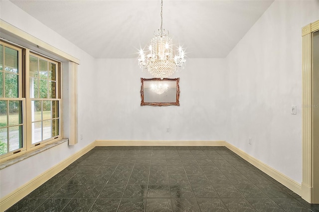 empty room featuring plenty of natural light and a chandelier