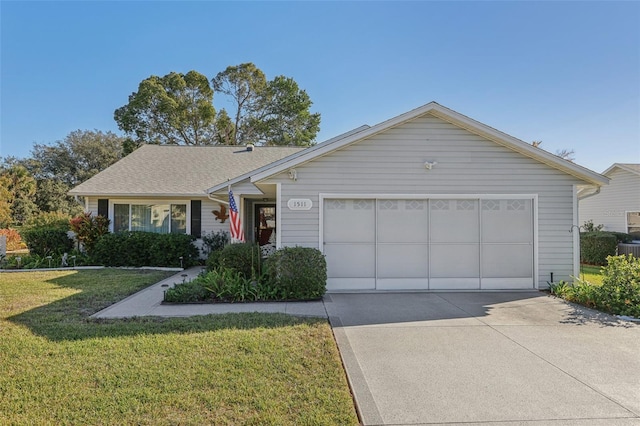 ranch-style house featuring a front yard and a garage