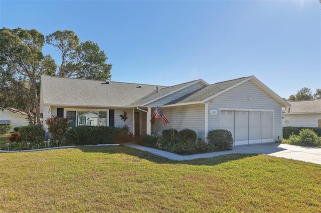 ranch-style home with a garage and a front lawn