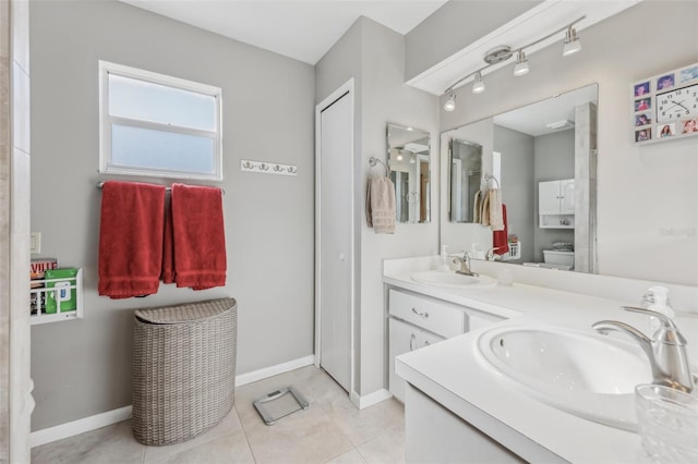 bathroom featuring tile patterned flooring, vanity, and toilet