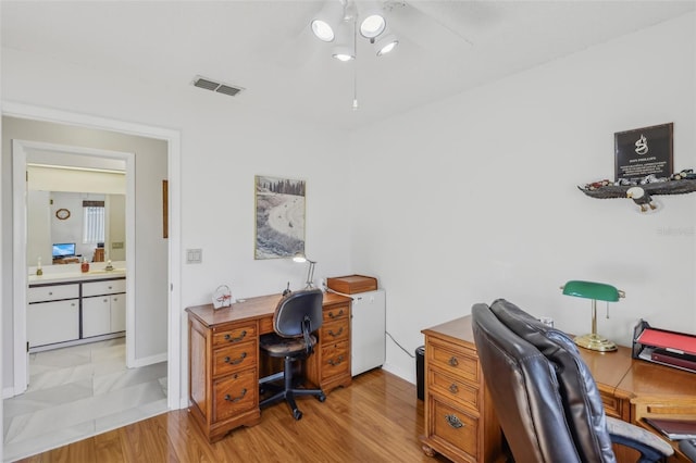 office space with light hardwood / wood-style flooring