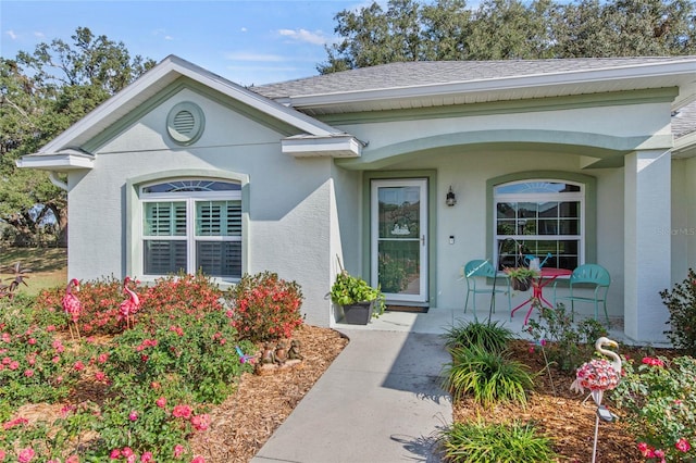 property entrance with covered porch