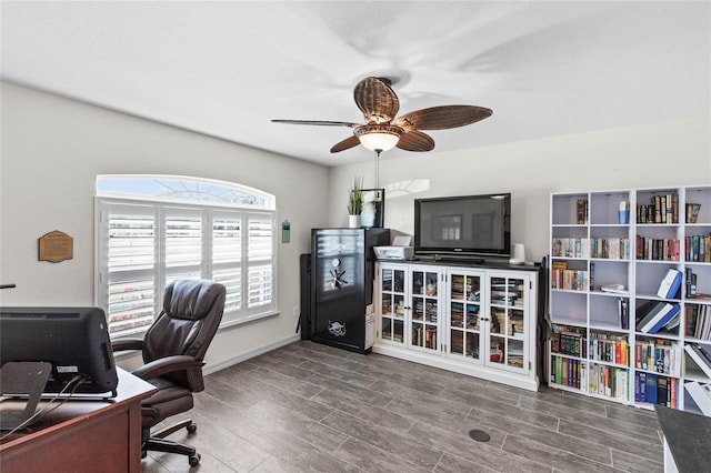 office featuring hardwood / wood-style flooring and ceiling fan