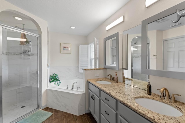 bathroom featuring vanity and plus walk in shower