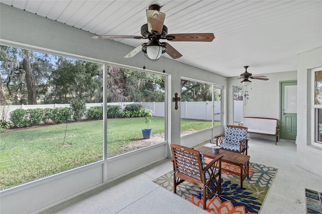 sunroom featuring ceiling fan