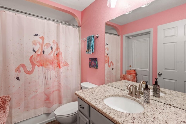 full bathroom featuring toilet, vanity, and shower / bath combo