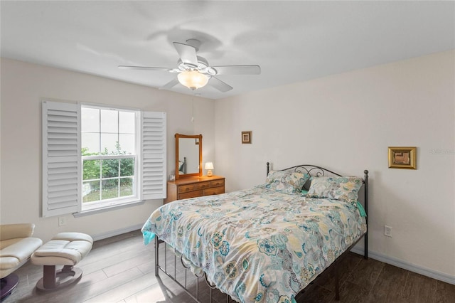 bedroom featuring ceiling fan and hardwood / wood-style flooring