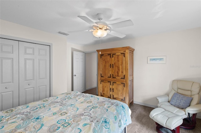 bedroom featuring ceiling fan, a closet, and carpet floors